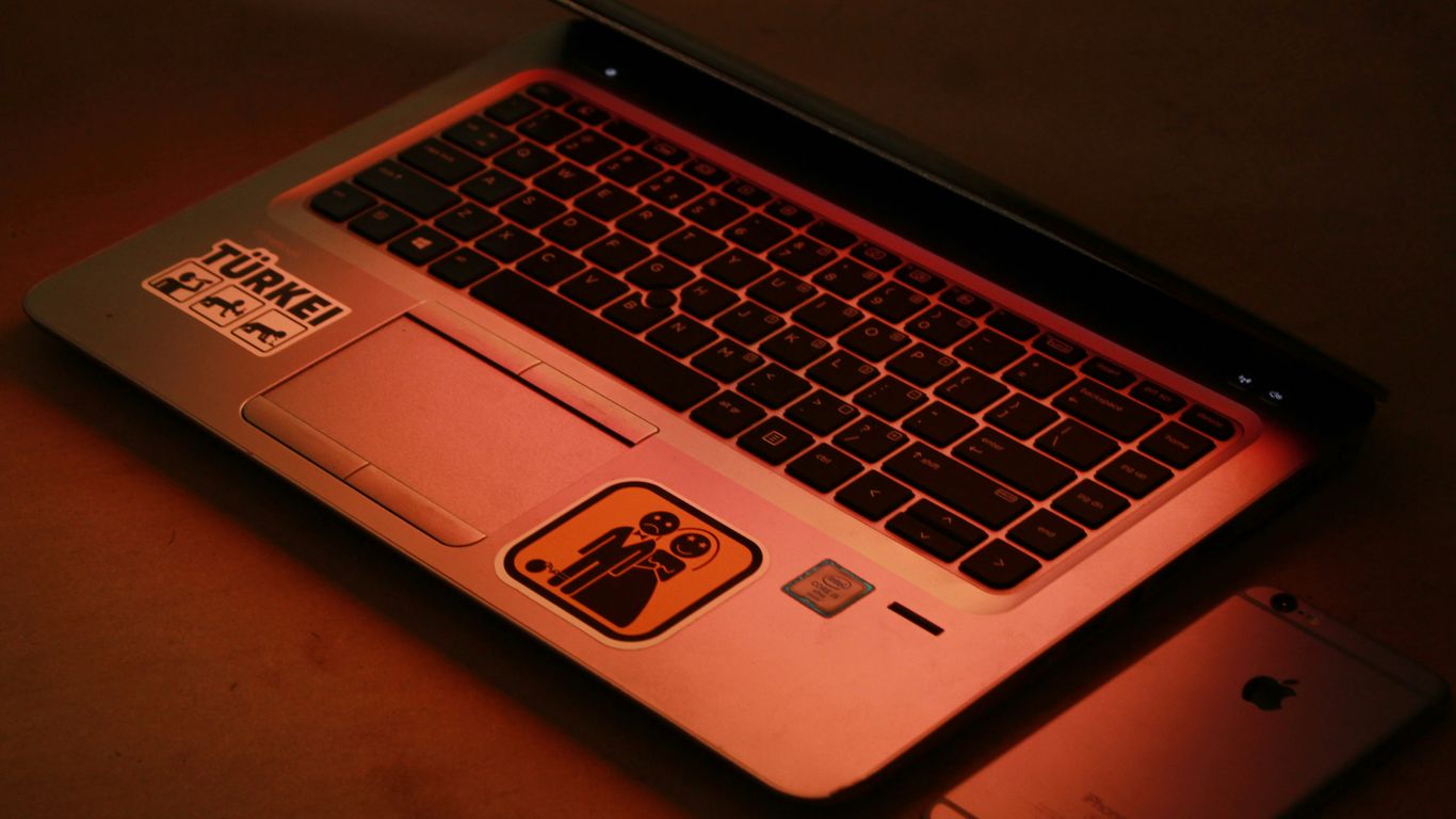 silver asus laptop computer on brown wooden table