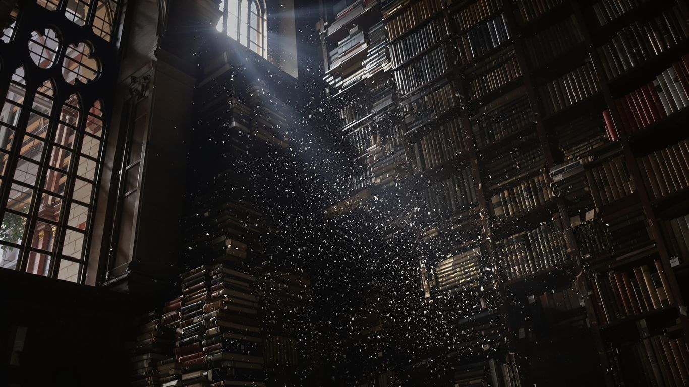 Ancient books in a sunlit library.