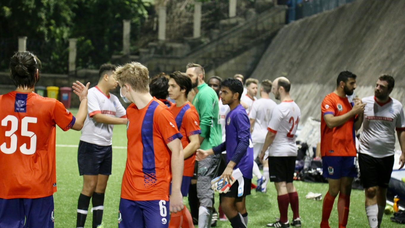 group of people in green and orange soccer jersey shirt