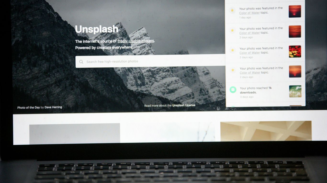 an open laptop computer sitting on top of a desk