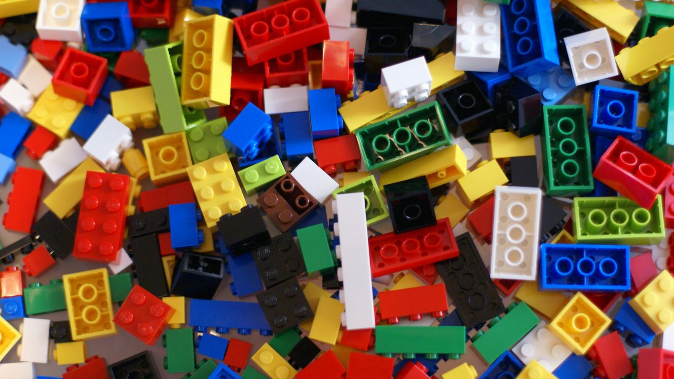 A pile of colorful legos sitting on top of a table