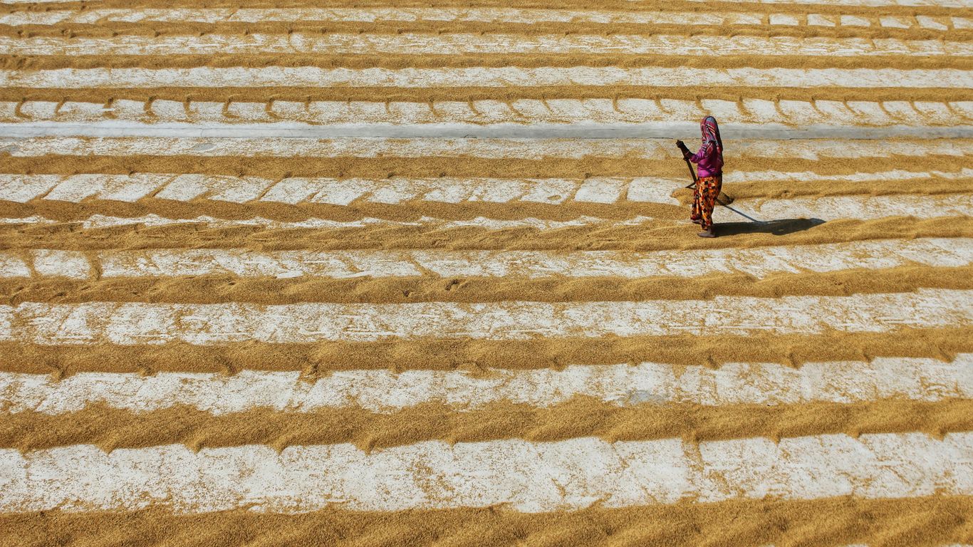 a person walking on a sand dune