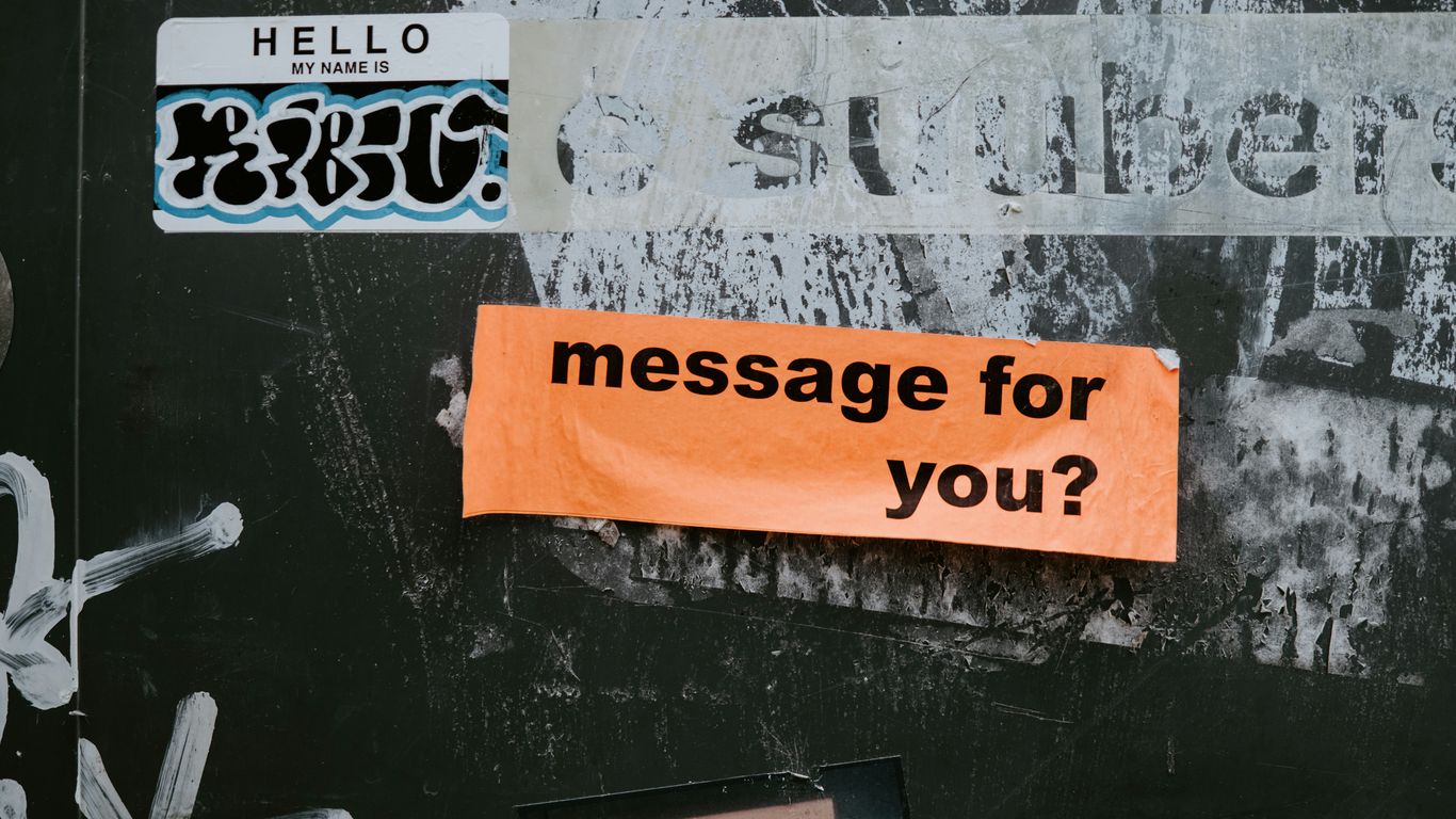 a sign on a wall that says message for you?