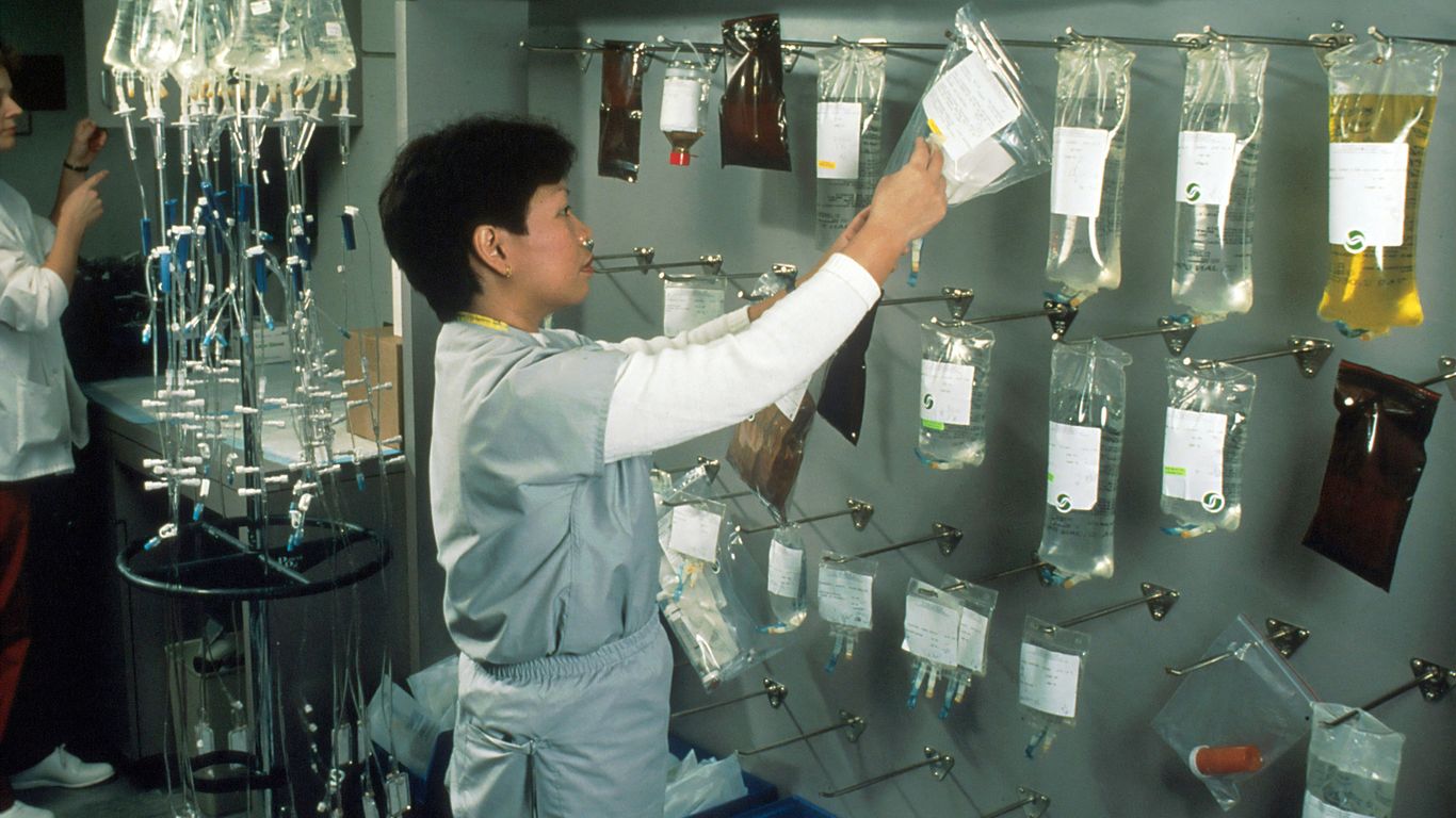 woman arranging IV bags