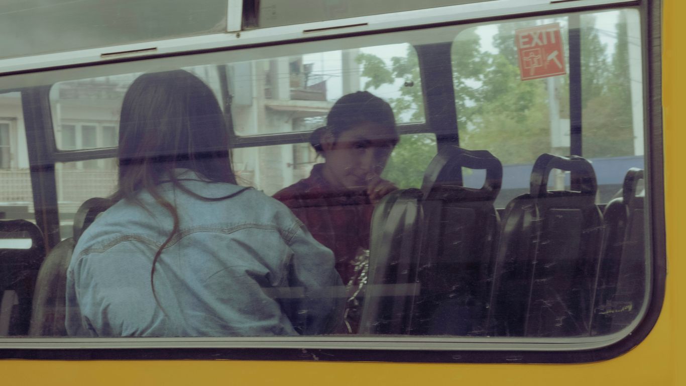 a man and woman on a bus