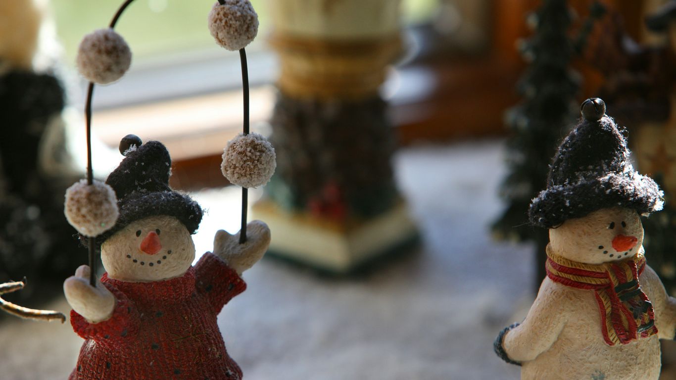 a couple of snowmen standing next to each other