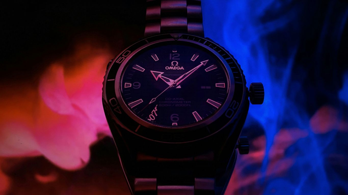 silver and black round analog watch