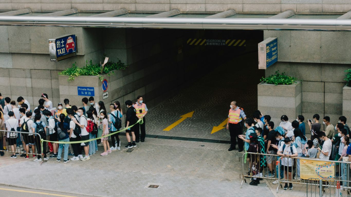 a group of people standing in front of a building