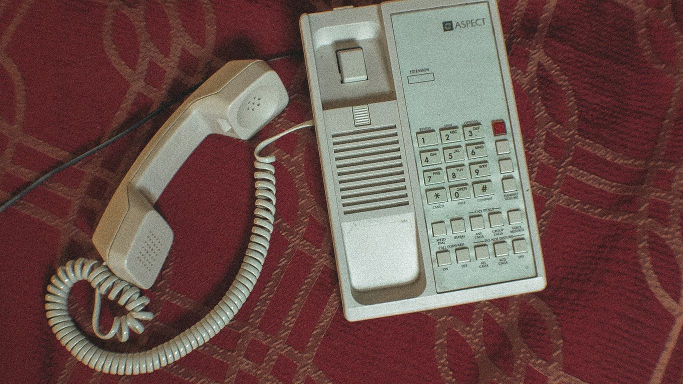 white corded home telephone