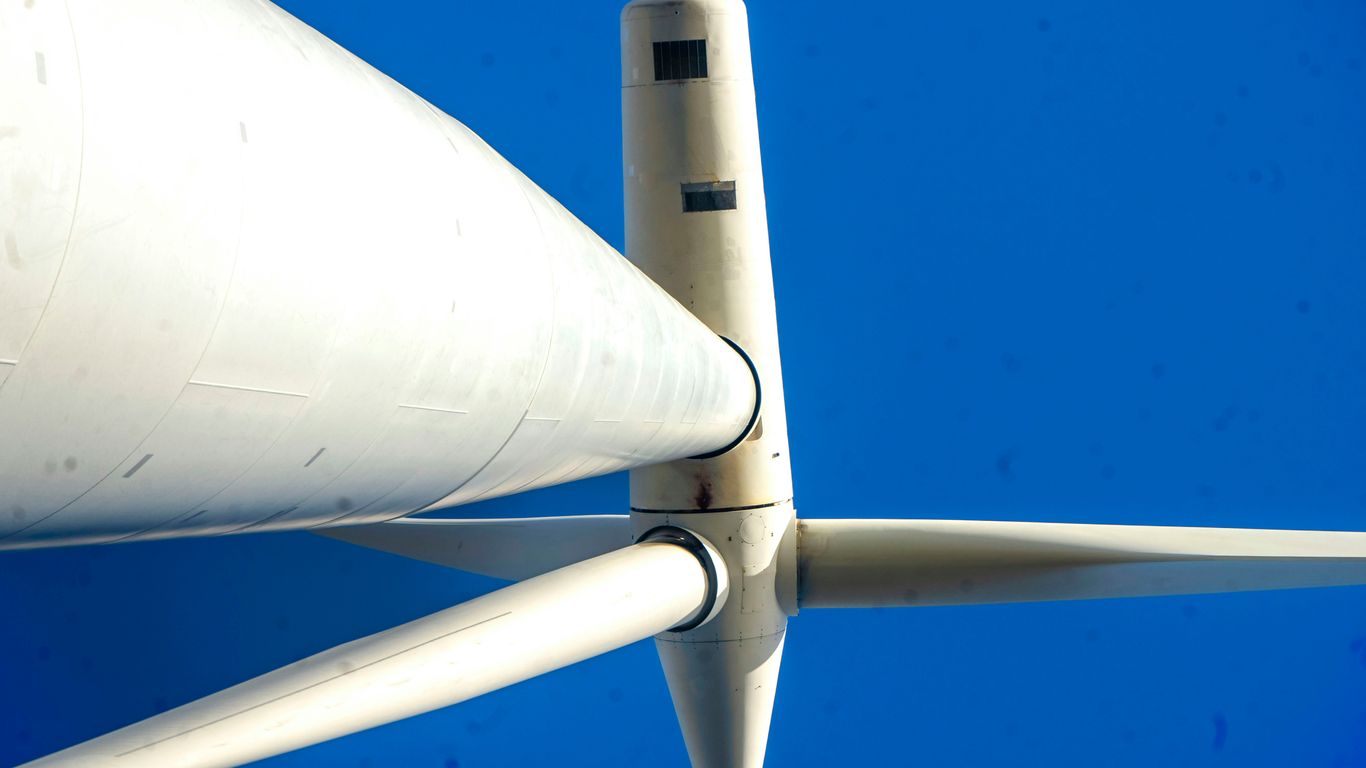 A close up of a white wind turbine