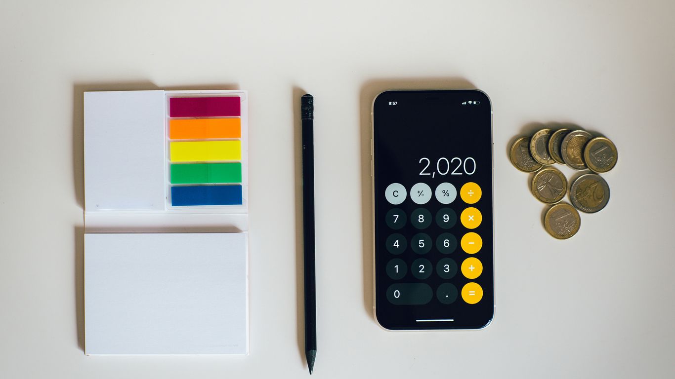 black iphone 4 beside black and silver remote control