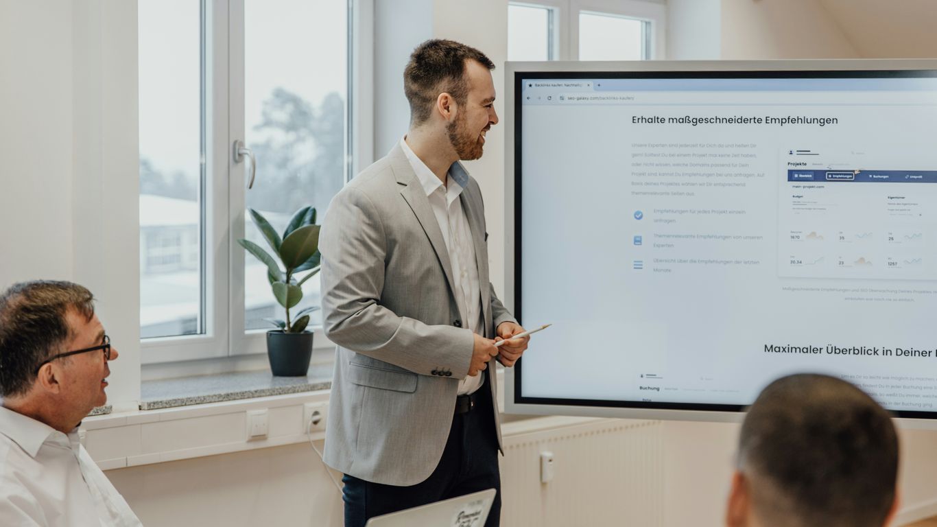 a man giving a presentation to a group of people