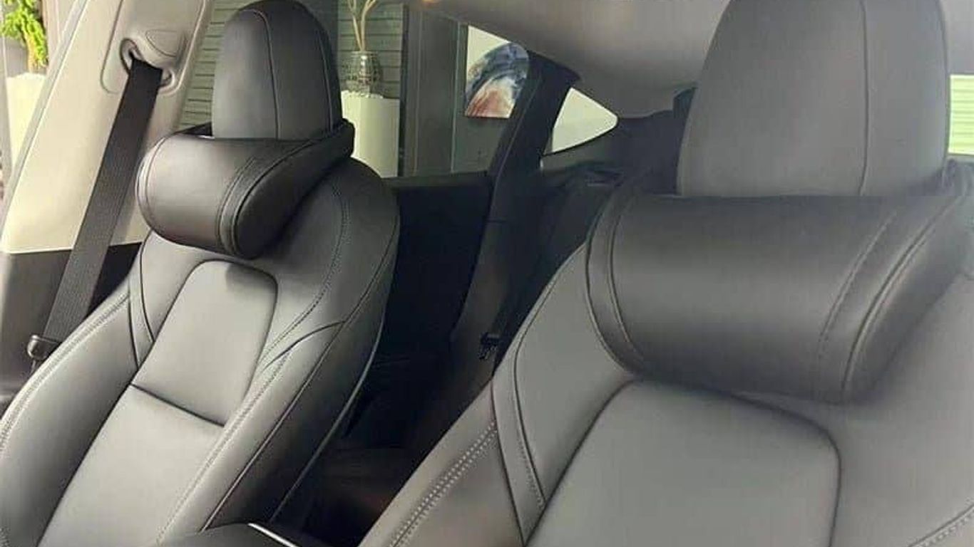 Interior of a modern car with leather seats and design.