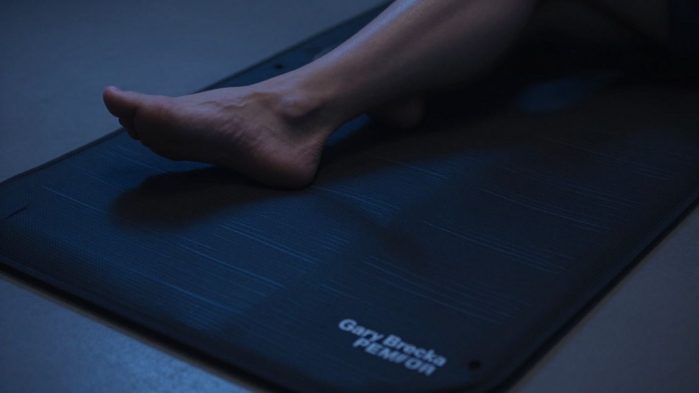 Gary Brecka PEMF mat with glowing patterns.