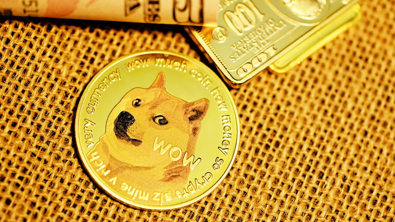 gold round coin on brown textile