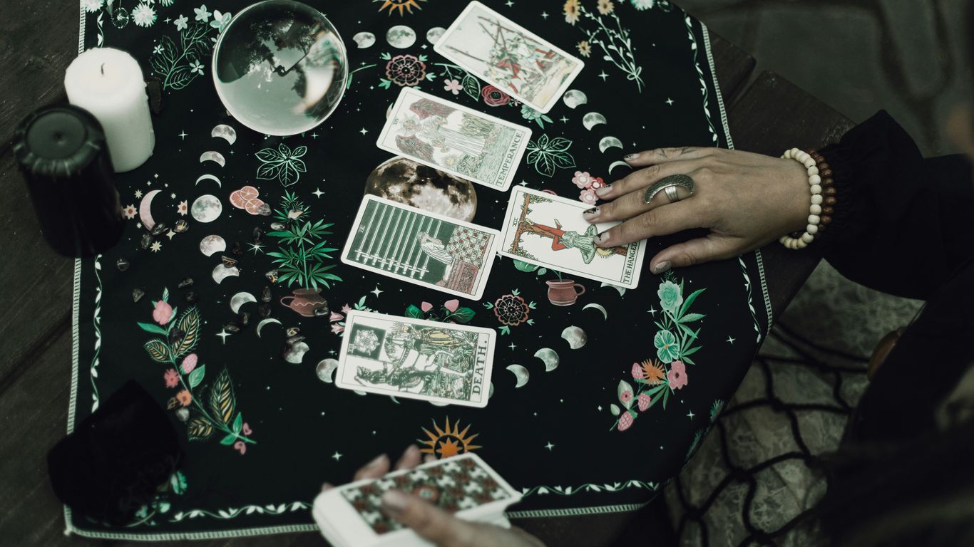 Tarot cards and crystals are used for divination.