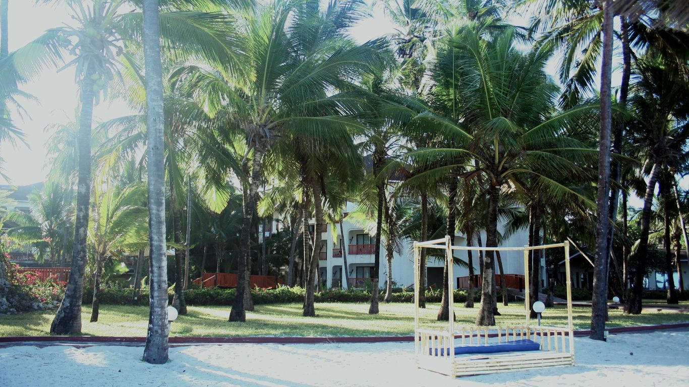 people standing on white sand beach during daytime