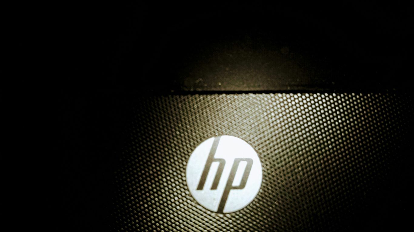 a close up of a hp logo on a laptop