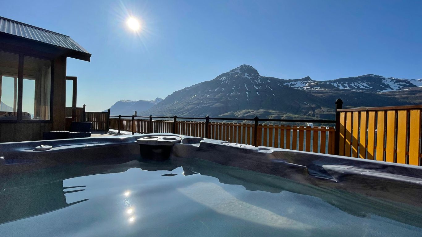 a hot tub sitting on top of a wooden deck