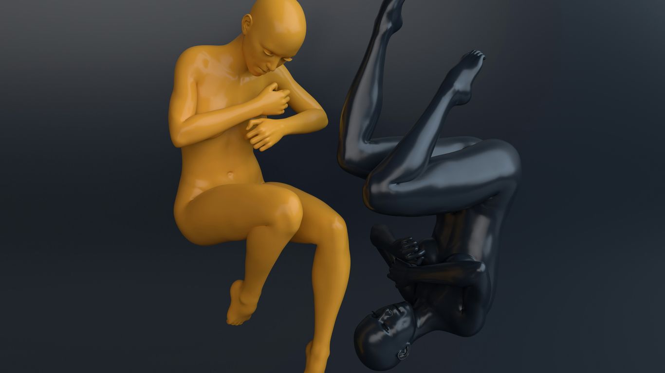 a couple of mannequins sitting next to each other