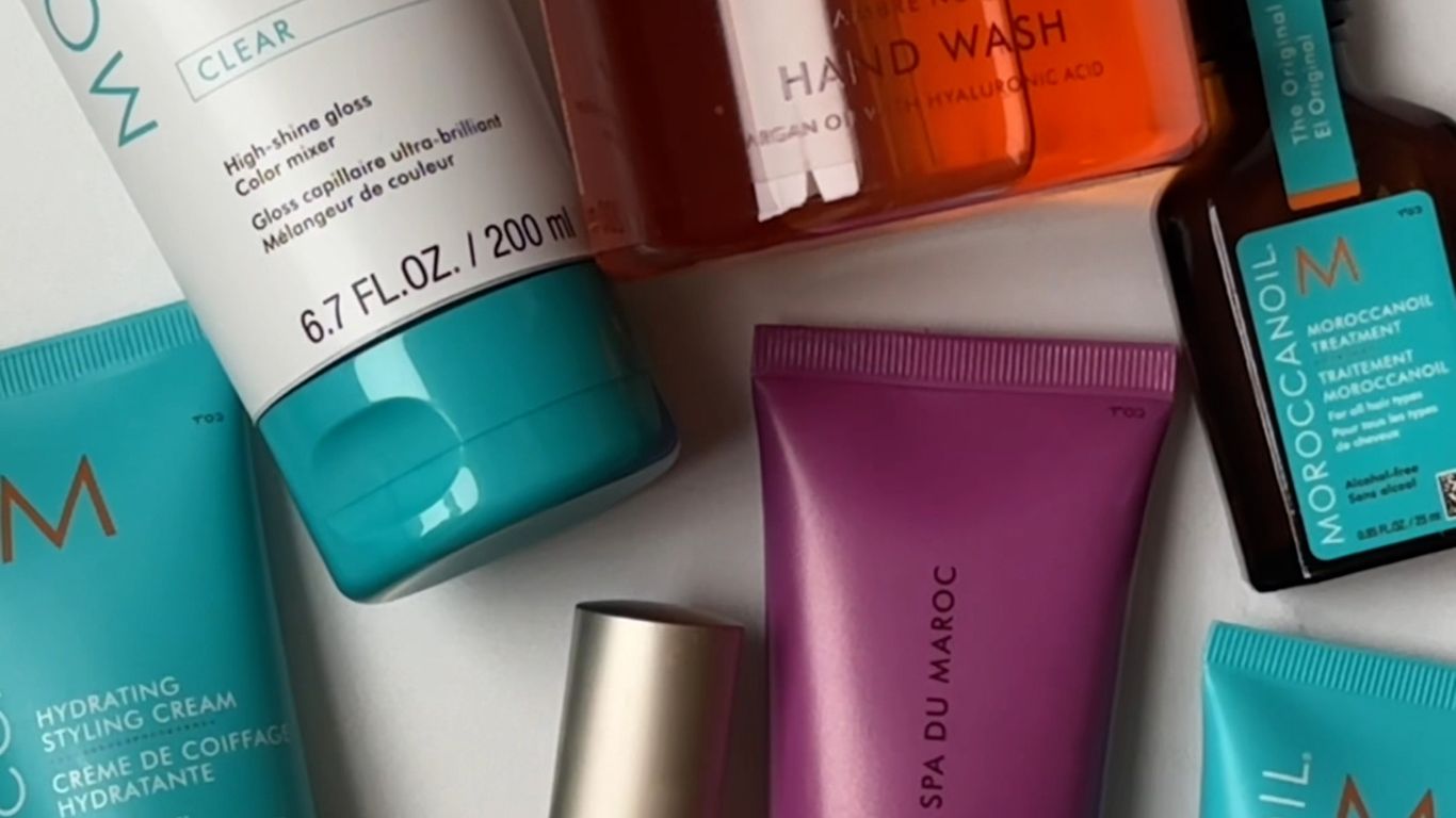 Assorted Moroccanoil branded beauty and haircare products in blue packaging.