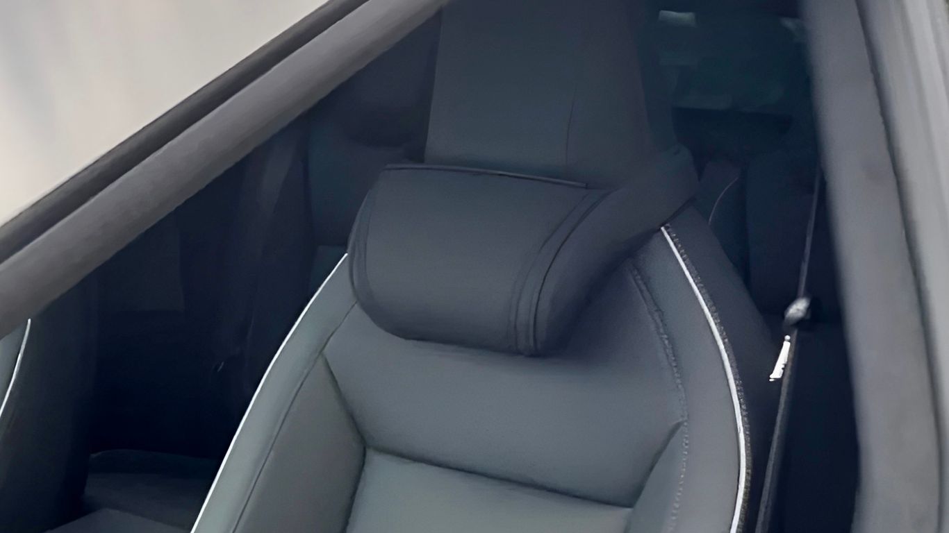 Interior view of a car showcasing a sleek, modern seat.
