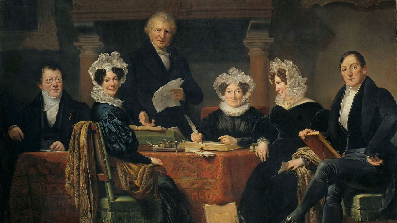 group of people sitting on brown wooden chair