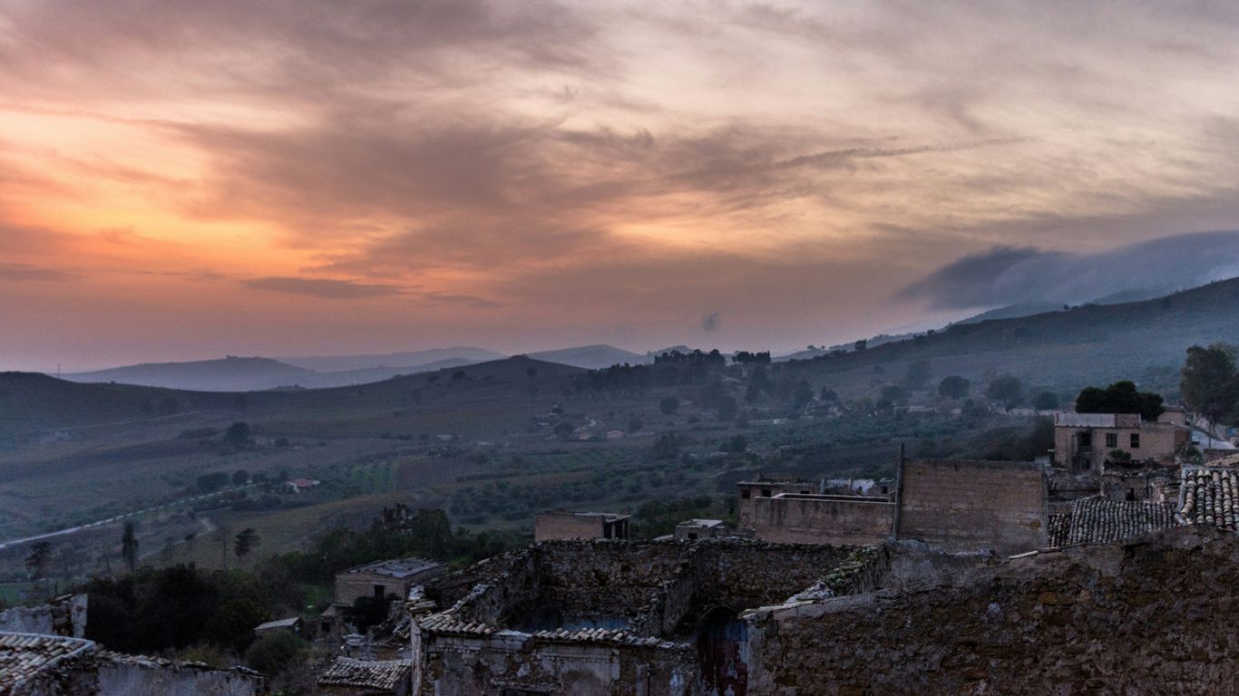 aerial view photography of village near mountain range