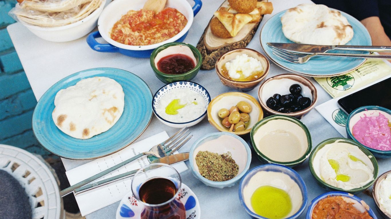 white ceramic bowl with soup and bread