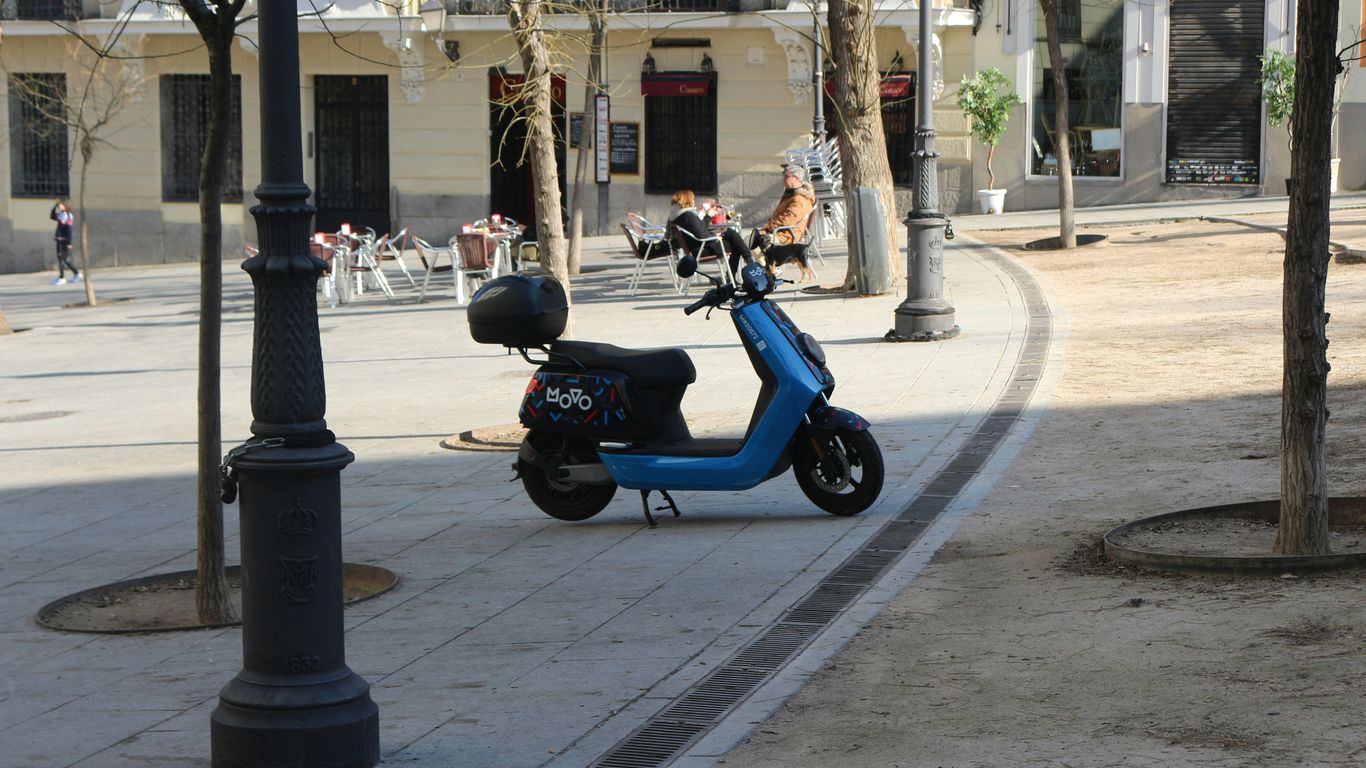 a scooter parked on the side of the road