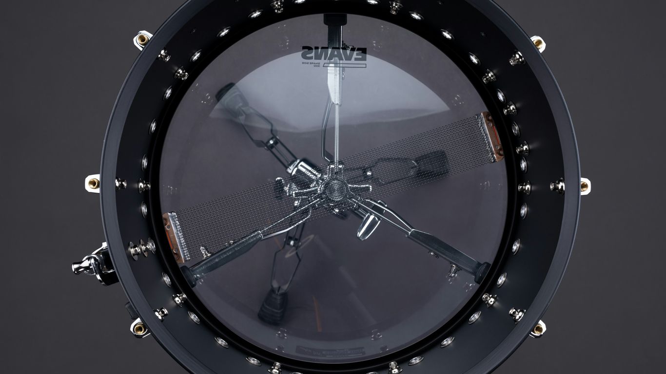 A clock hanging from the side of a building