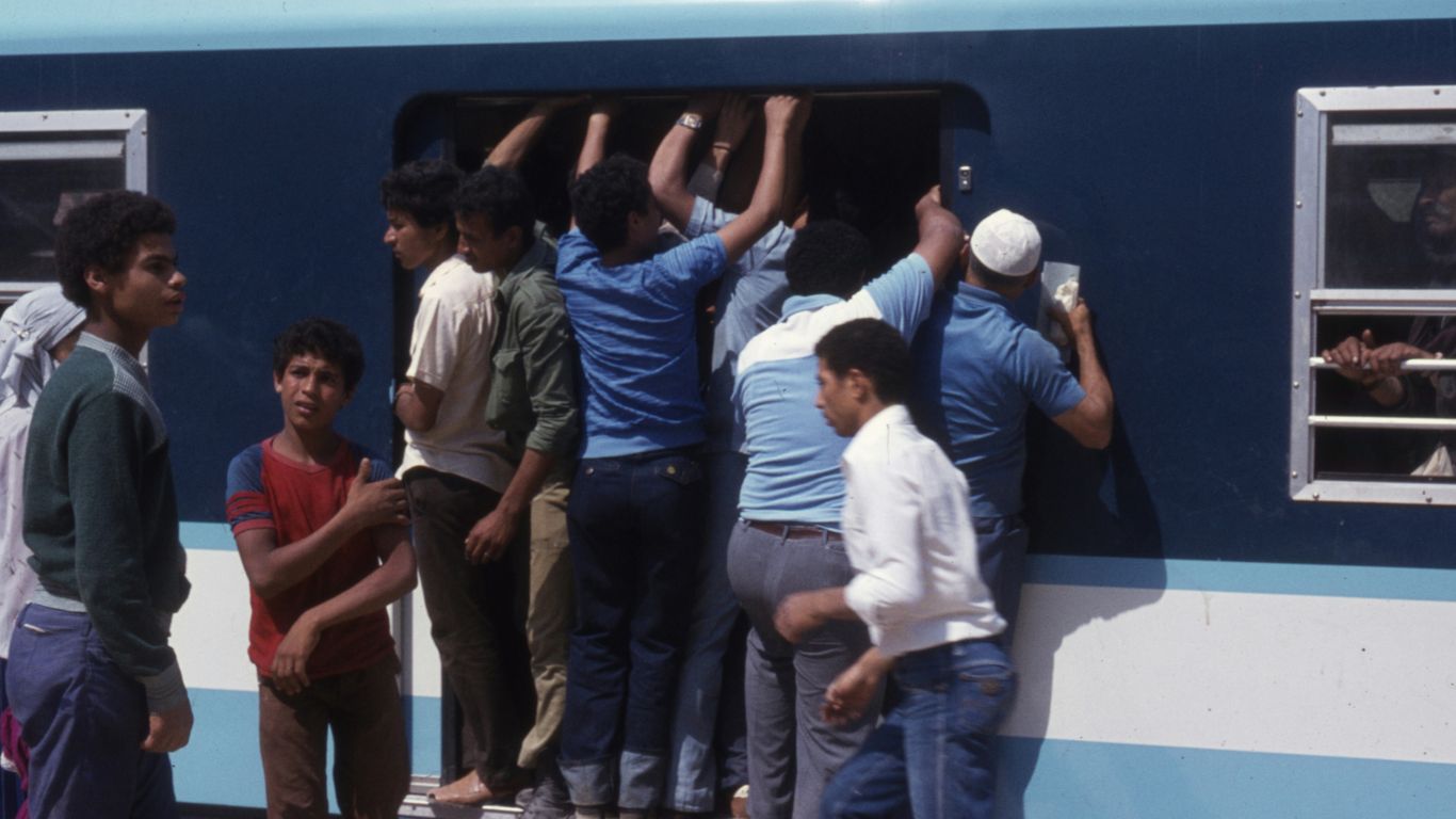 group of people standing on gray concrete floor