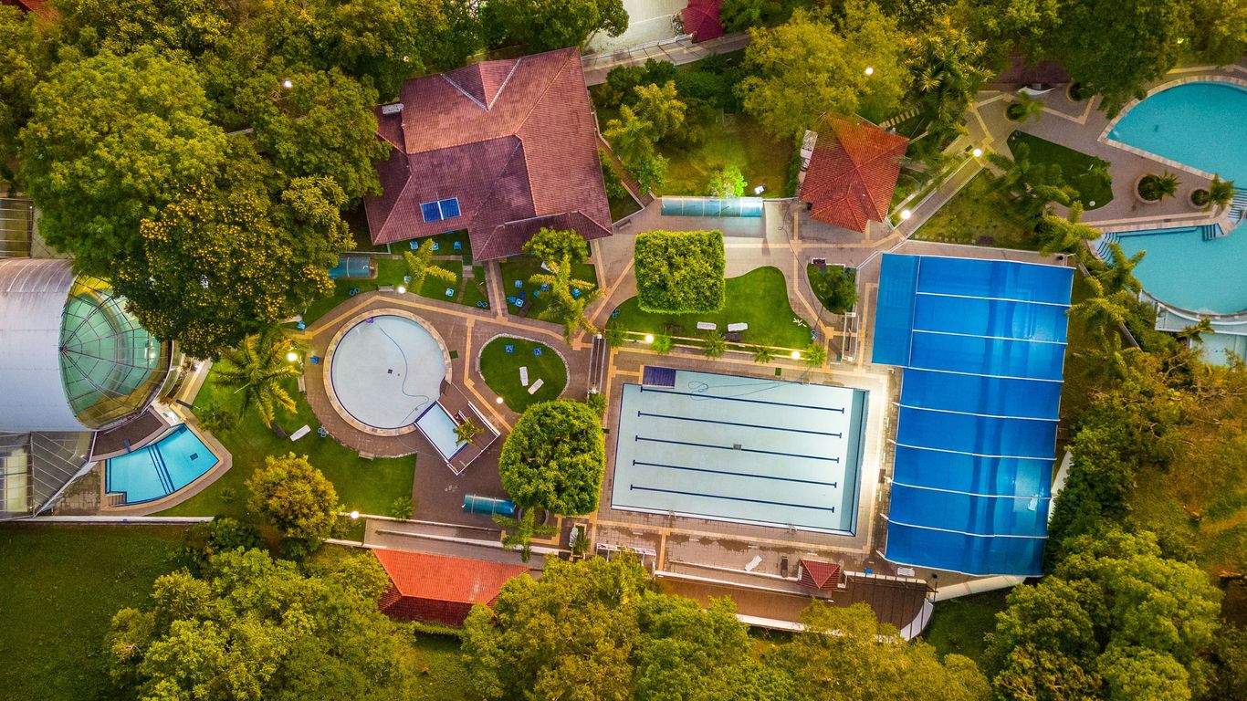 a bird's - eye view of an aerial view of a swimming pool and