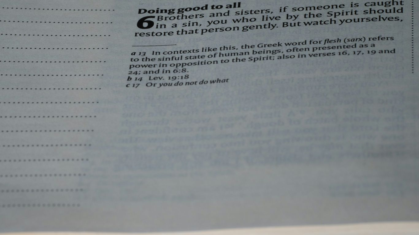 A close up of an open book with text