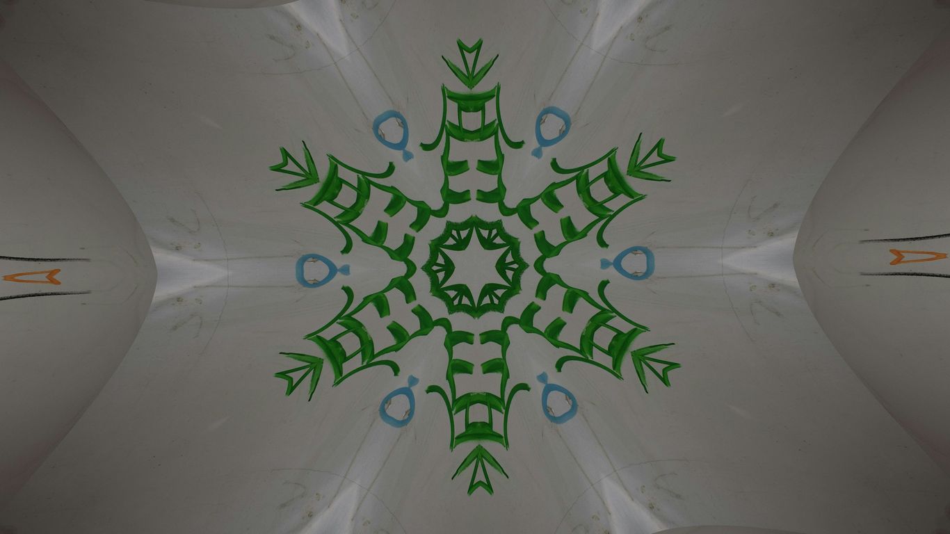 A kaleidoscope design with a green and blue pattern.