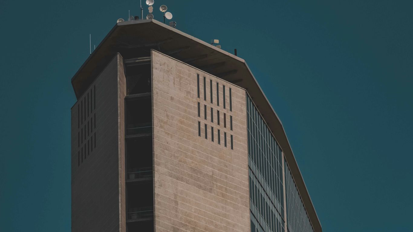 brown concrete building under blue sky during daytime
