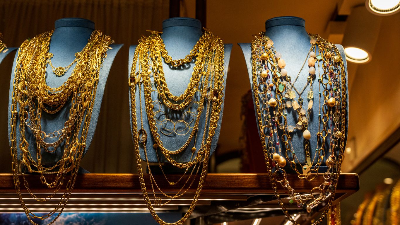A bunch of necklaces that are on a shelf