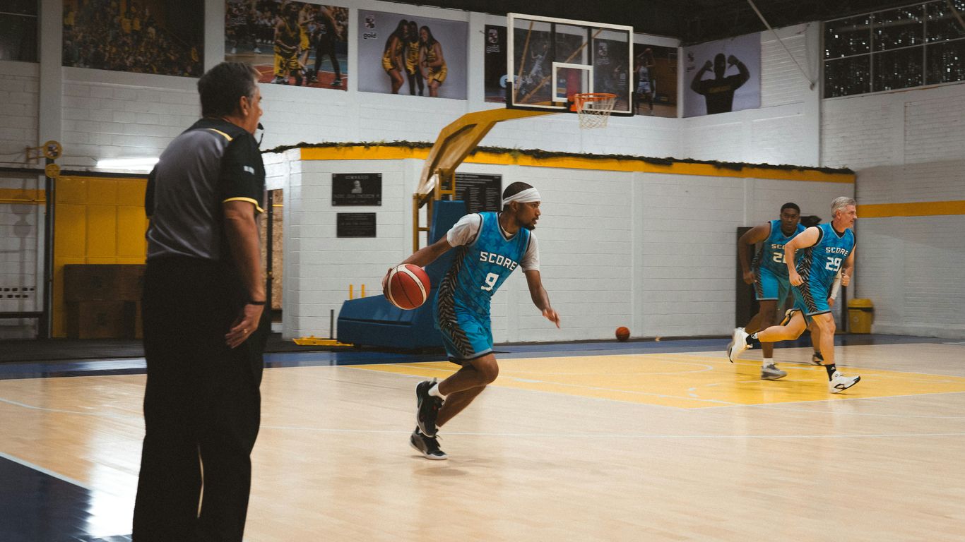 Basketball players practicing on a court