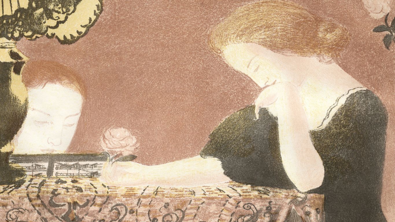 woman writing in journal with a thoughtful expression