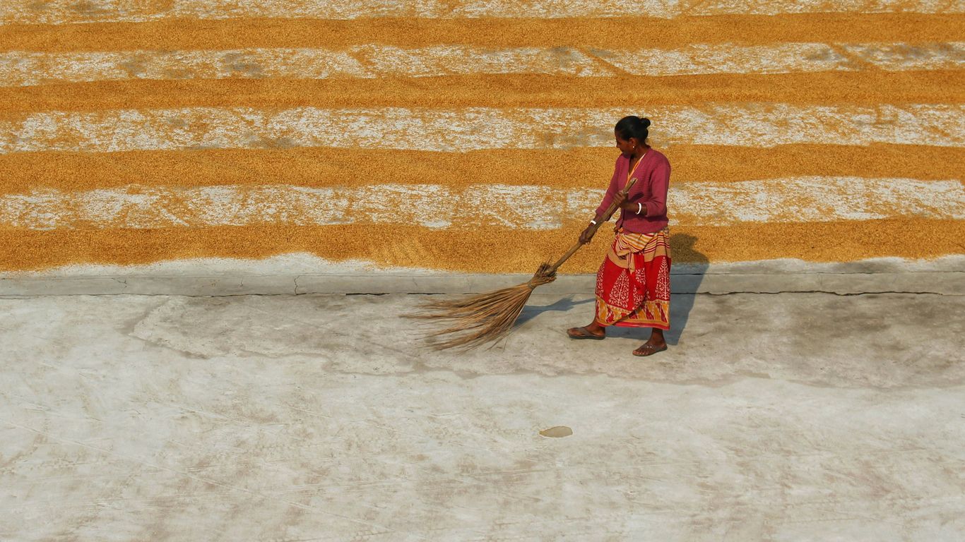 a man holding a broom