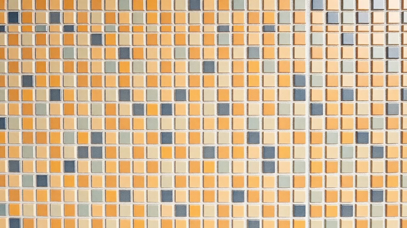 Diagonal mosaic tile pattern on a wall.