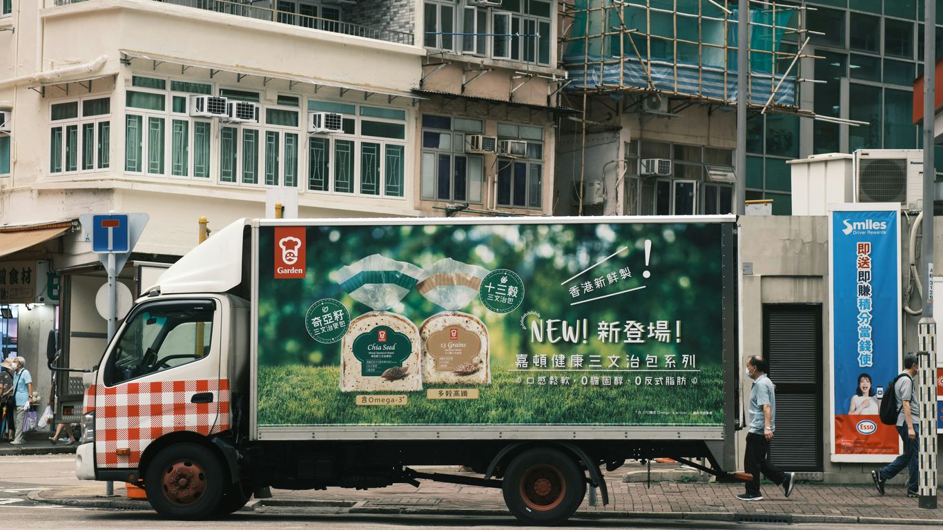 A delivery truck is parked on a city street.