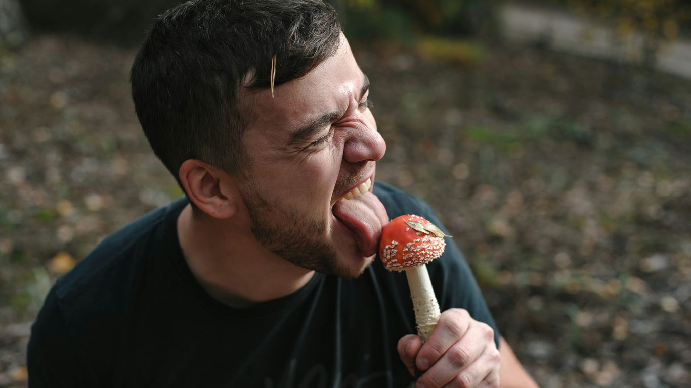 man in black crew neck shirt eating ice cream