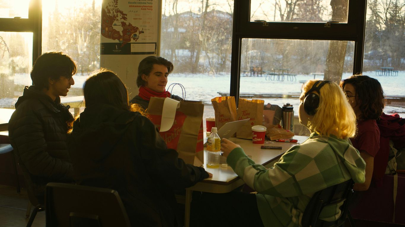 a group of people sitting around a table