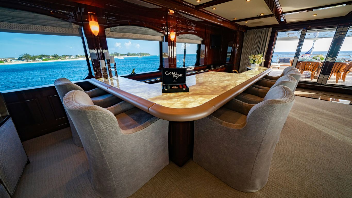 a table with chairs and a book on top of it