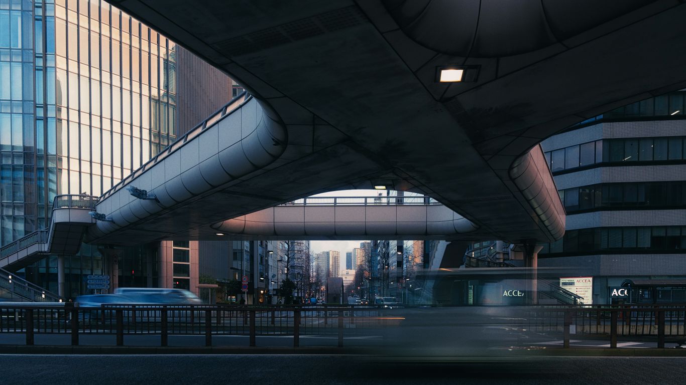 Modern city overpass with buildings and traffic below