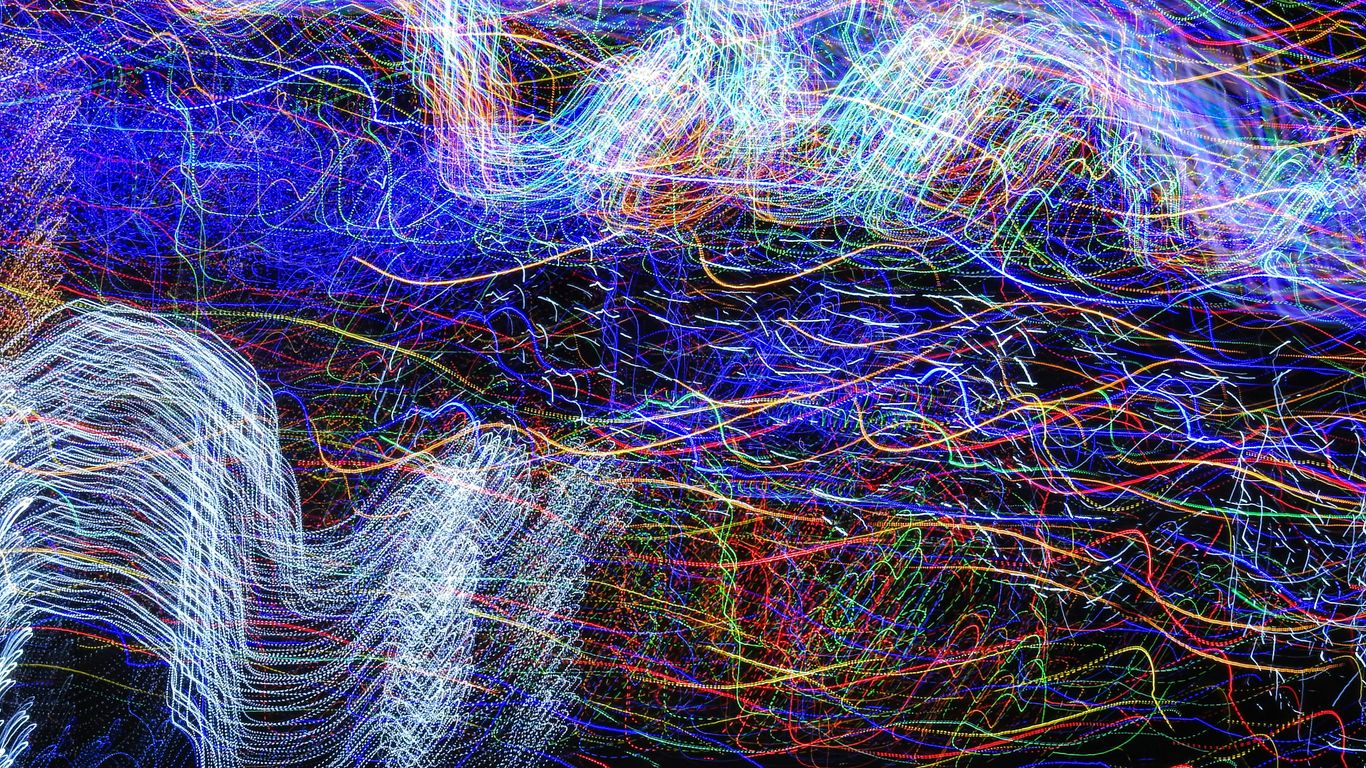 a blurry photo of lights in the dark