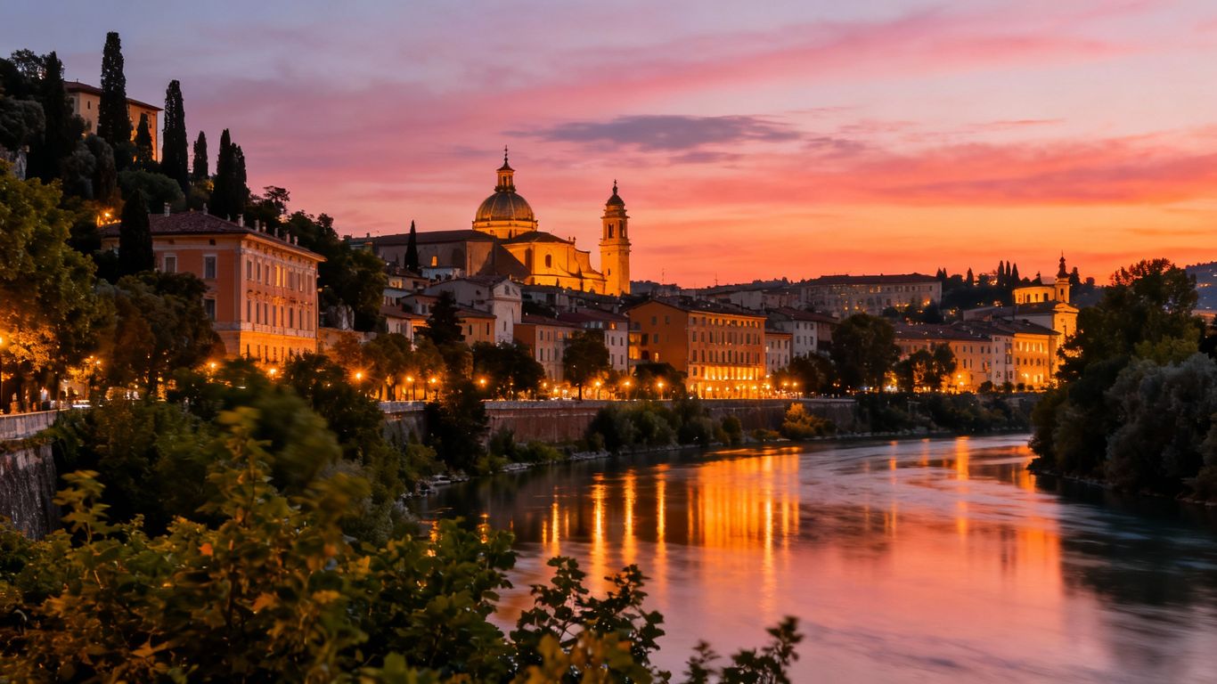 Underrated city skyline at dusk with river and greenery.