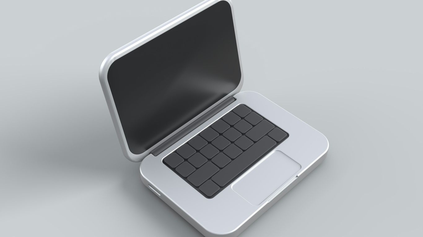 an open laptop computer sitting on top of a table