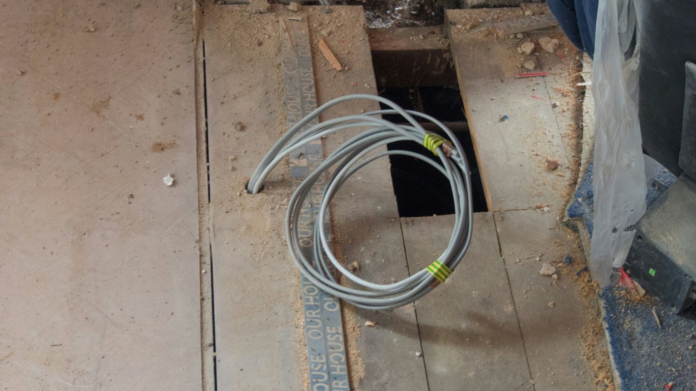 white coated wire on floor